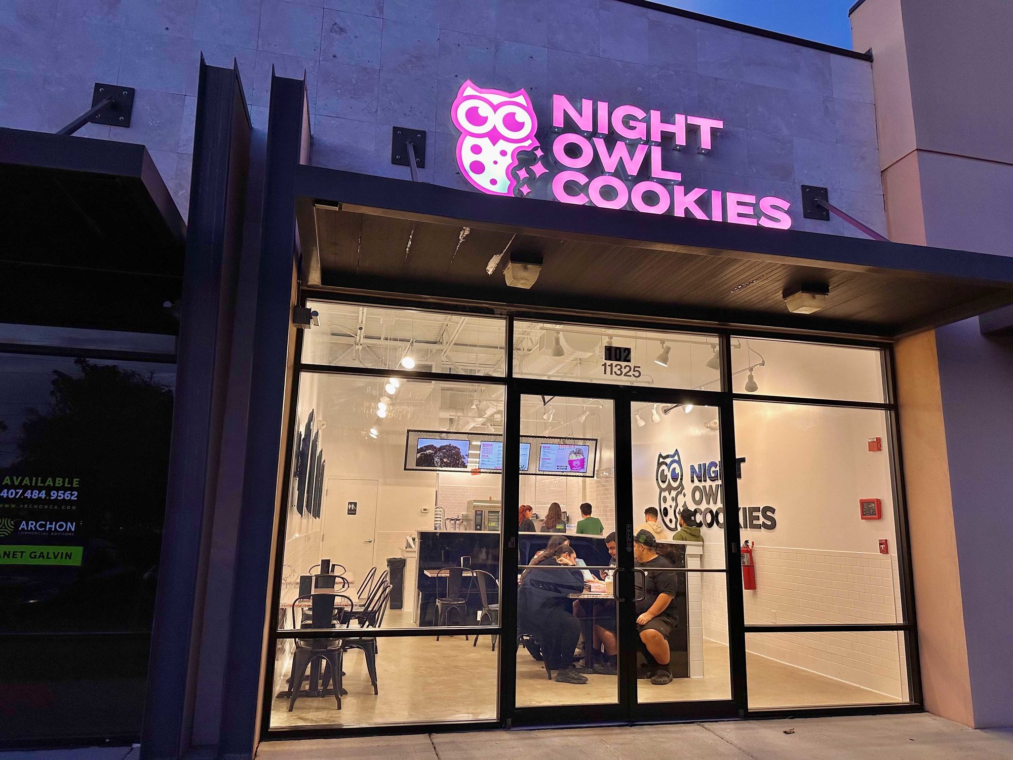 outside of the night owl cookies building with pink lettering